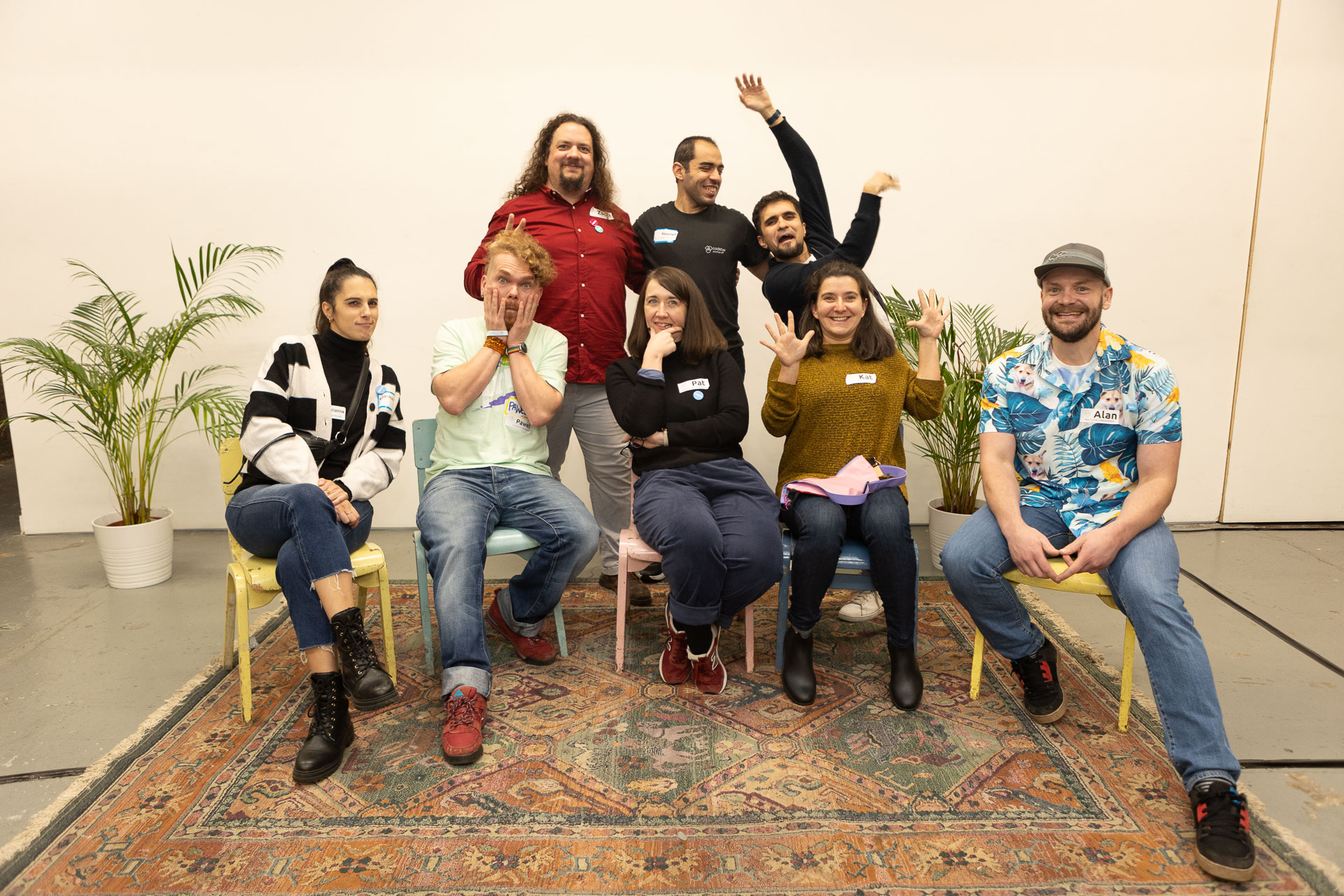 A photo of the Scotland team at uncodebar - 8 people together laughing and pulling funny faces.